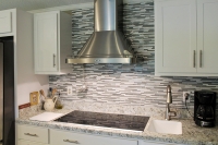painted white kitchen closeup view of hood and backsplash